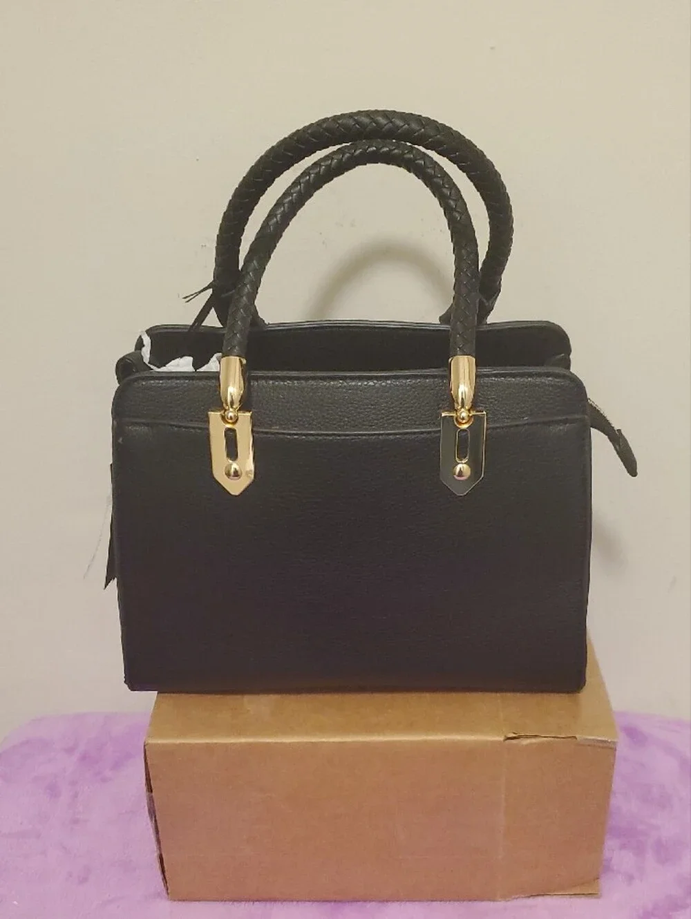 Structured Black Satchel with Braided Handles and Gold Accents